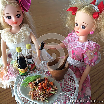 Two friends are enjoy eating Som Tam. Spicy yummy papaya salad. Editorial Stock Photo